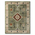 Area rug in green with geometric and floral patterns 150 x 90 x 1cm